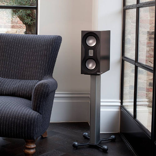 Monitor Audio speakers on a stand in the corner of the living room